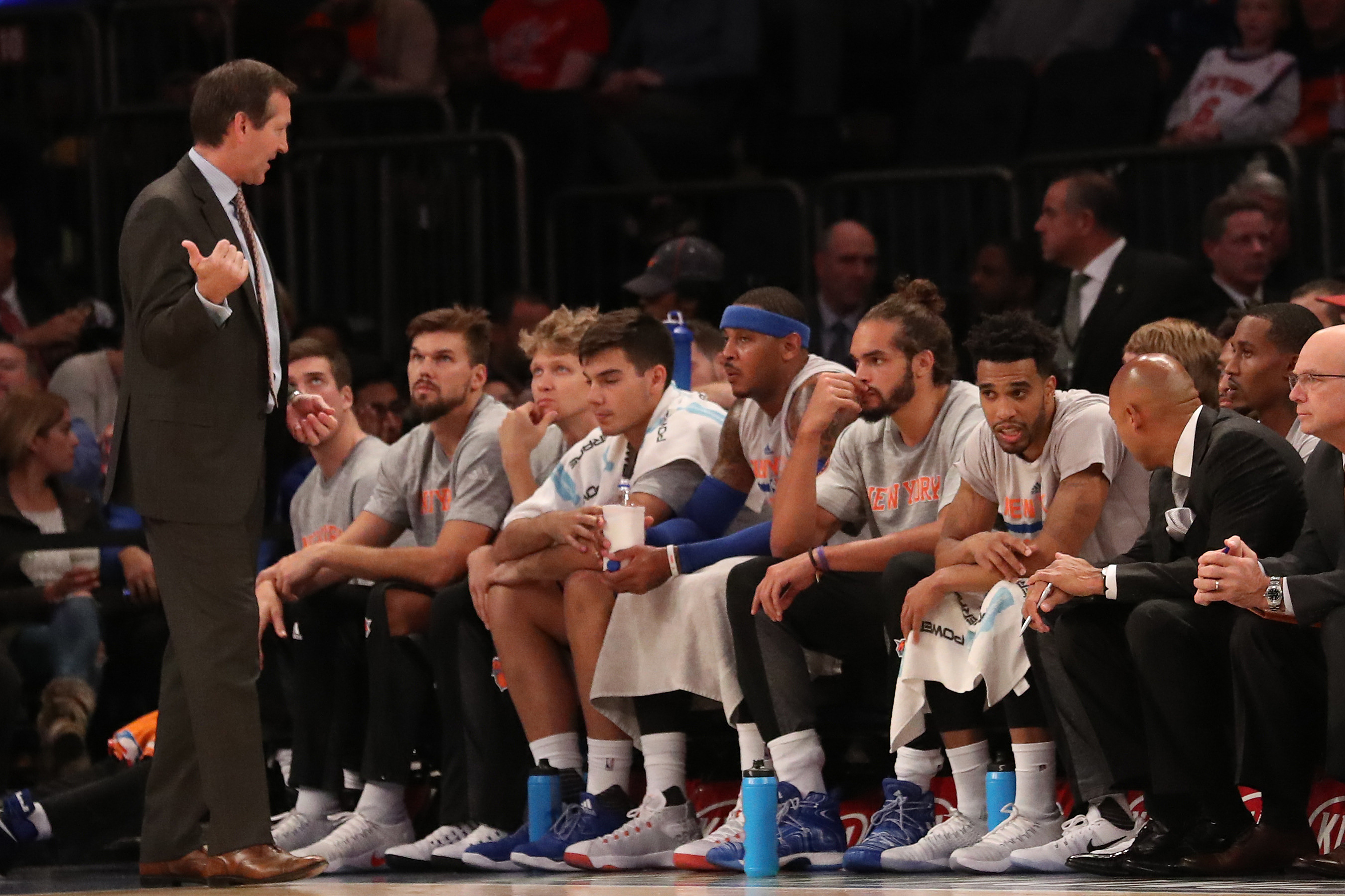 Oct 10, 2016; New York, NY, USA; New York Knicks head coach Jeff Hornacek (L) speaks to his players on the bench during the second quarter against the Washington Wizards at Madison Square Garden. Mandatory Credit: Anthony Gruppuso-USA TODAY Sports