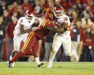 Nov 3, 2016; Ames, IA, USA; Oklahoma Sooners fullback Dimitri Flowers (36) is tackled by Iowa State Cyclones linebacker Willie Harvey (7) at Jack Trice Stadium. Oklahoma beat Iowa State 34 to 24. Mandatory Credit: Reese Strickland-USA TODAY Sports