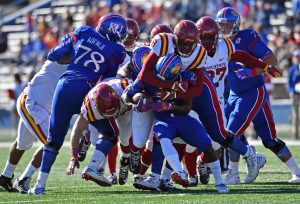 Nov 12, 2016; Lawrence, KS, USA; Iowa State Cyclones defensive tackle Jhaustin Thomas (8) tackles Kansas Jayhawks running back Ke'aun Kinner (22) during the first half at Memorial Stadium. Mandatory Credit: Peter G. Aiken-USA TODAY Sports